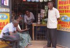 People using mobile phones outdoors