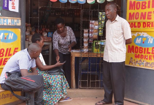 People using mobile phones outdoors