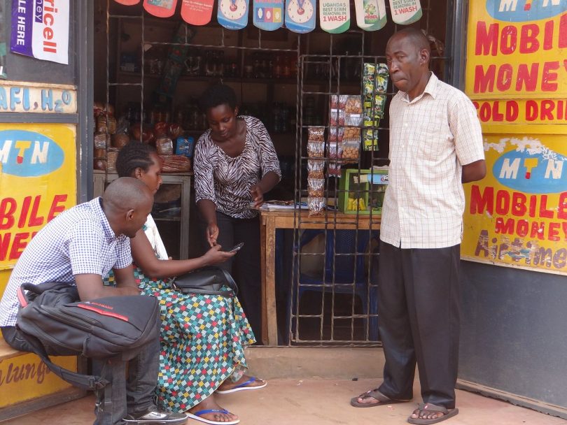 People using mobile phones outdoors