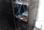 blue network cables organised in a server room