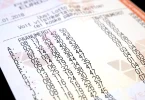 A European lottery ticket held beside its printed entry form